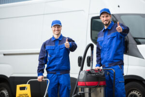 Portrait Of Two Happy Male Janitors
